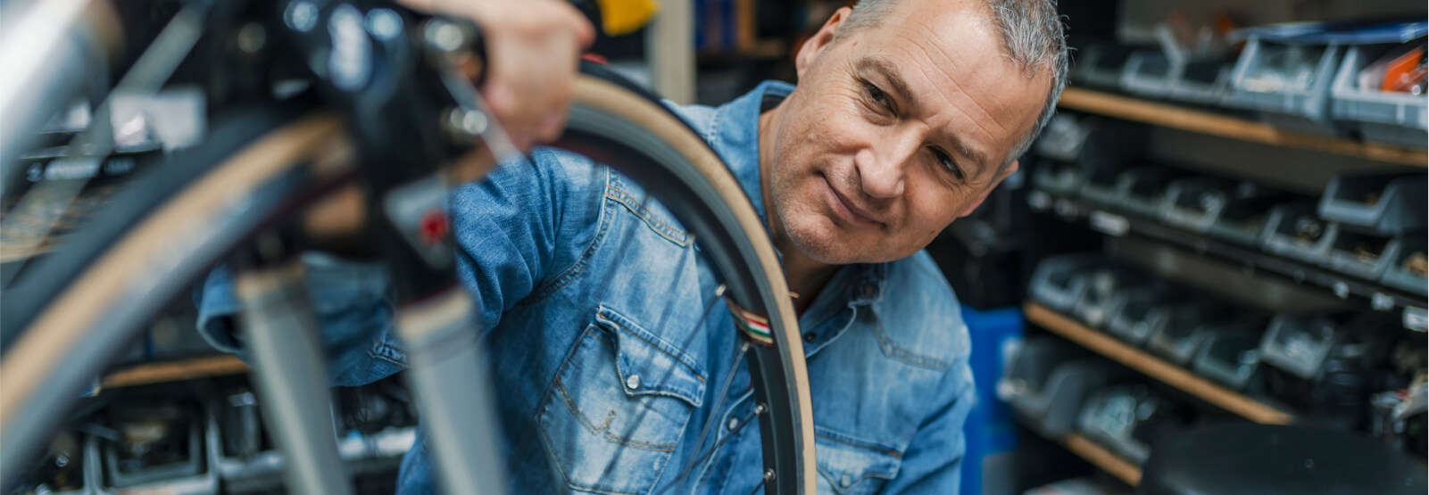 Man inspecting a bicycle