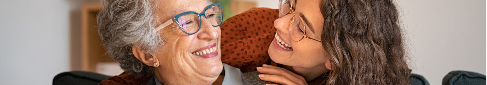 A young woman and an older woman embracing